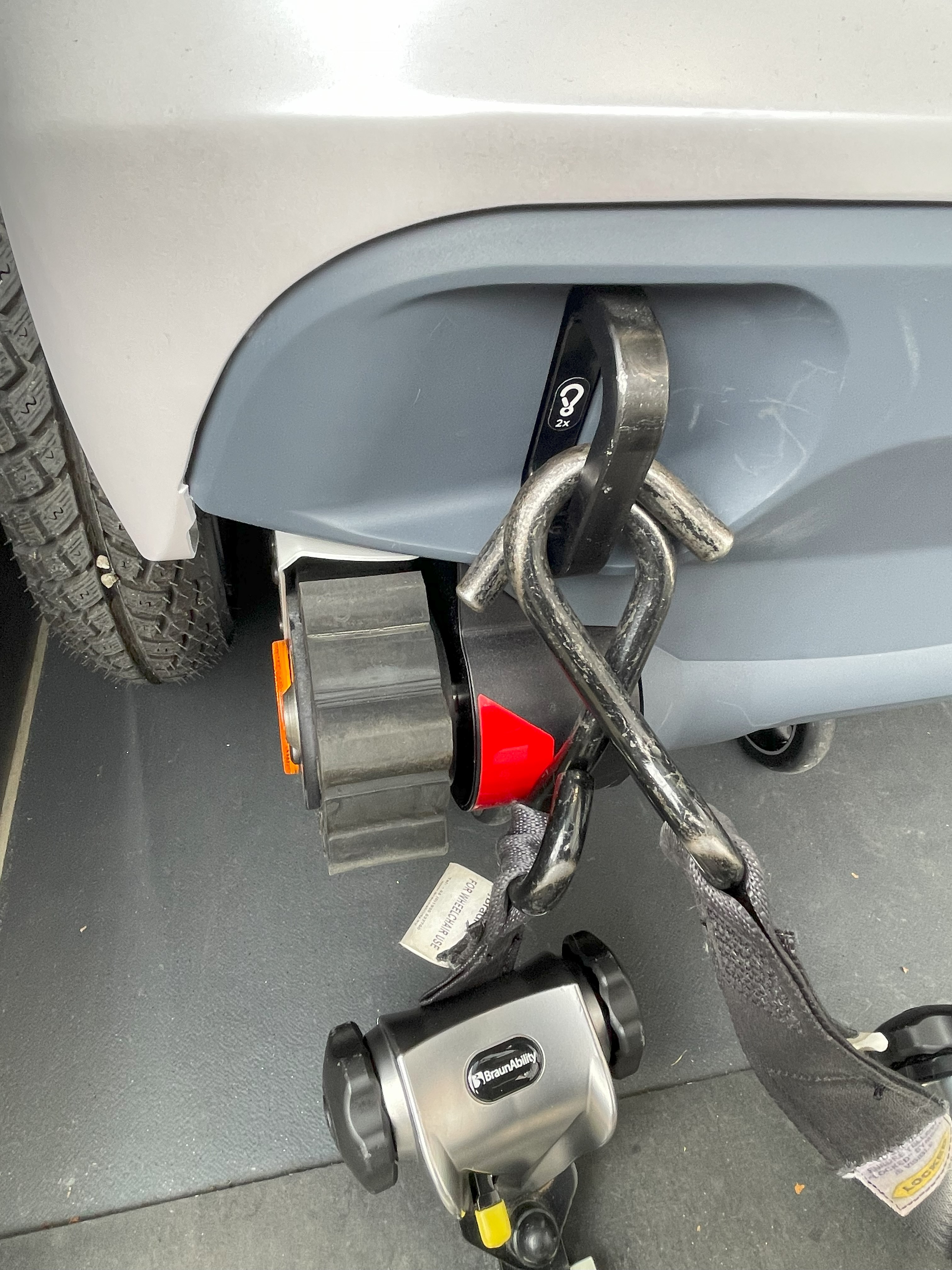 Securing the wheelchair as a passenger seat in the vehicle